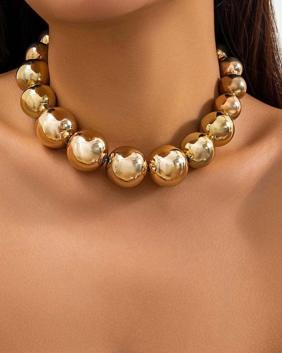 Golden punk choker necklace with oversized geometric spheres, made from 316L Stainless Steel, bold and edgy fashion accessory