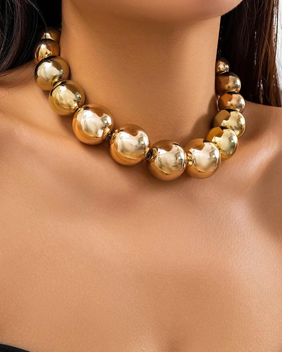 Golden punk choker necklace with oversized geometric spheres, made from 316L Stainless Steel, bold and edgy fashion accessory