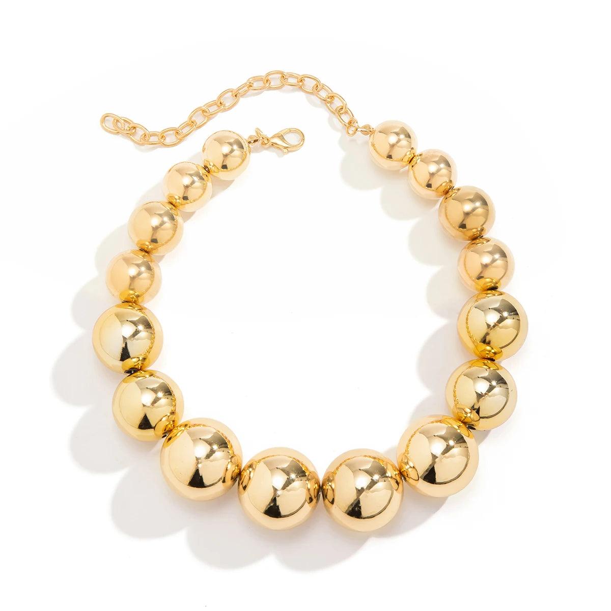 Golden punk choker necklace with oversized geometric spheres, made from 316L Stainless Steel, bold and edgy fashion accessory