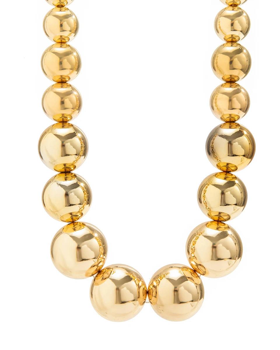 Golden punk choker necklace with oversized geometric spheres, made from 316L Stainless Steel, bold and edgy fashion accessory