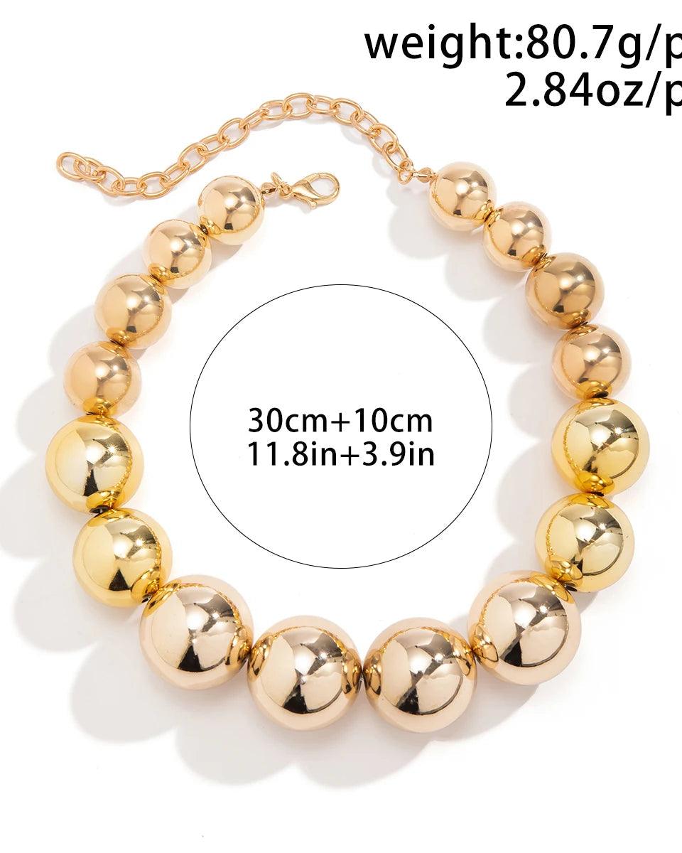 Golden punk choker necklace with oversized geometric spheres, made from 316L Stainless Steel, bold and edgy fashion accessory