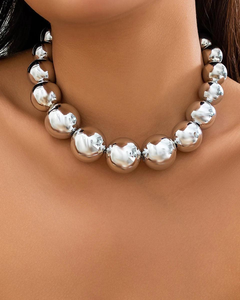 Silver punk choker necklace with oversized geometric spheres, made from 316L Stainless Steel, bold and edgy fashion accessory