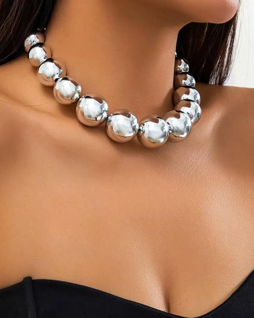 Silver punk choker necklace with oversized geometric spheres, made from 316L Stainless Steel, bold and edgy fashion accessory